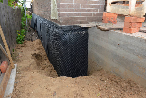 Happy homeowners after waterproofing job in Pickett